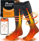 Frostlauf Heizsocken in Anthrazit mit orangen Ringstreifen, Heizgrafik am Fuß, Box und Smartphone im Hintergrund